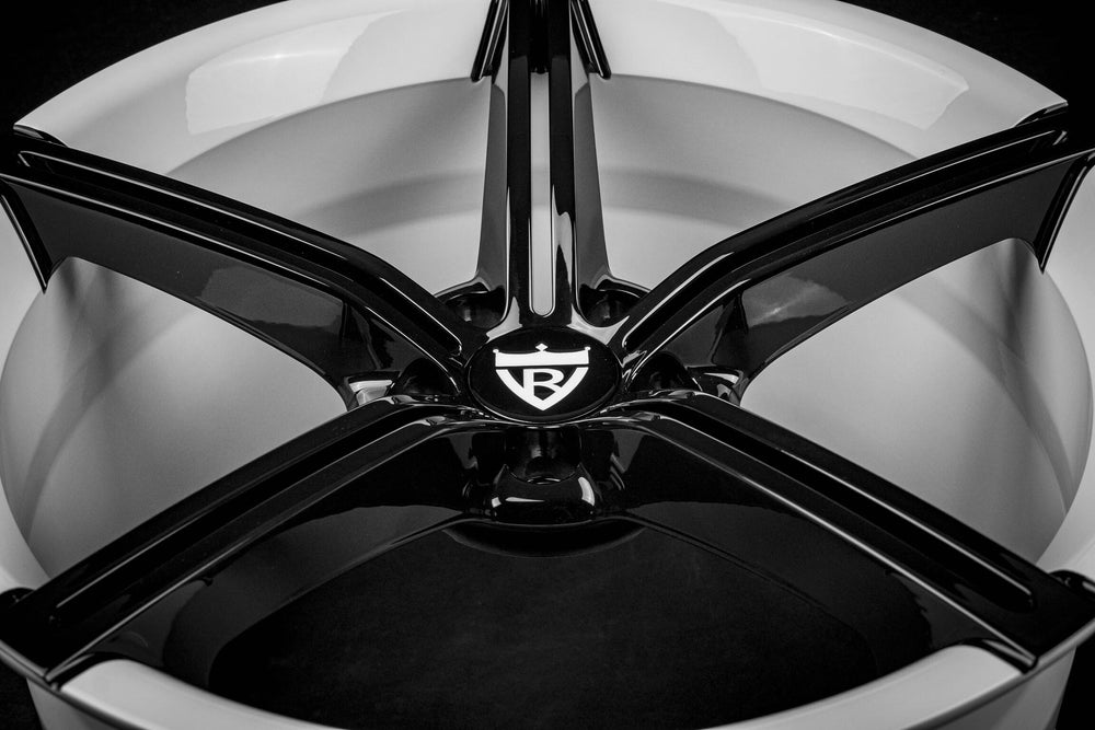 Detailed shot of black and white finish on R8 forged wheels