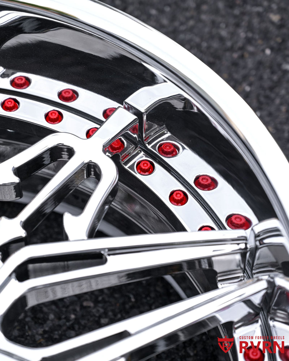Forged machining detail of RM-01 chrome wheel, highlighting precision milling and deep lip design.