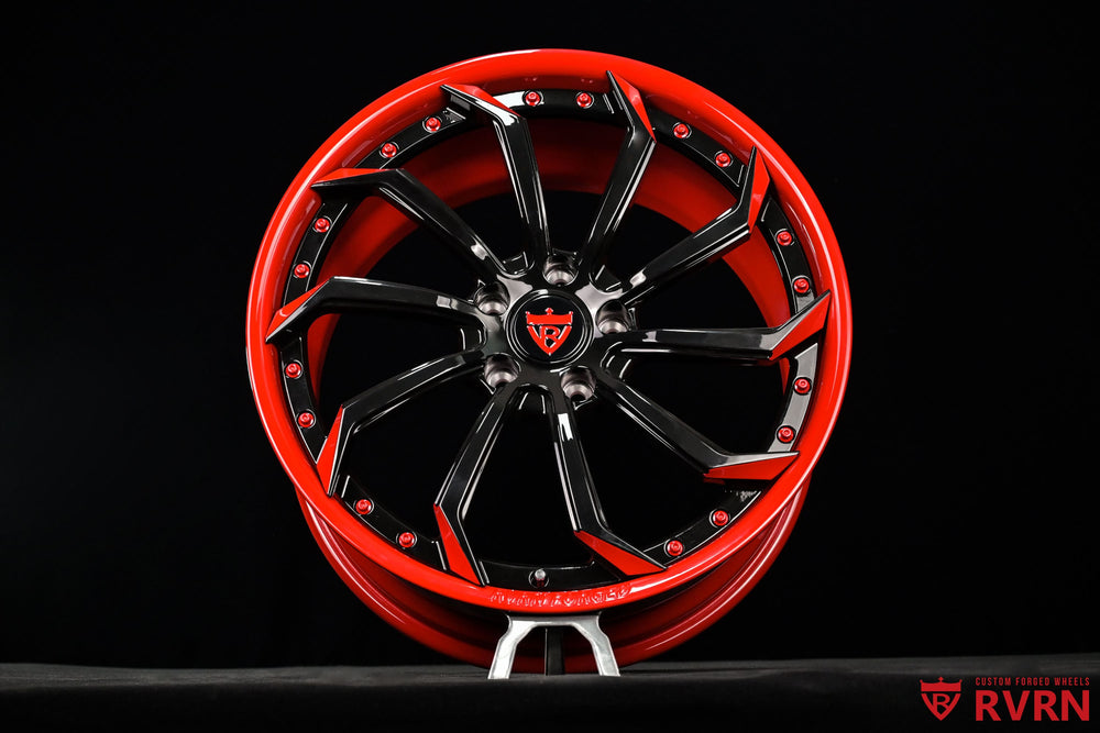 Detailed wheel face of RVRN RV-DC01 directional forged wheels for the Corvette C7, showing the red and black spoke design and 19x8.5 fitment