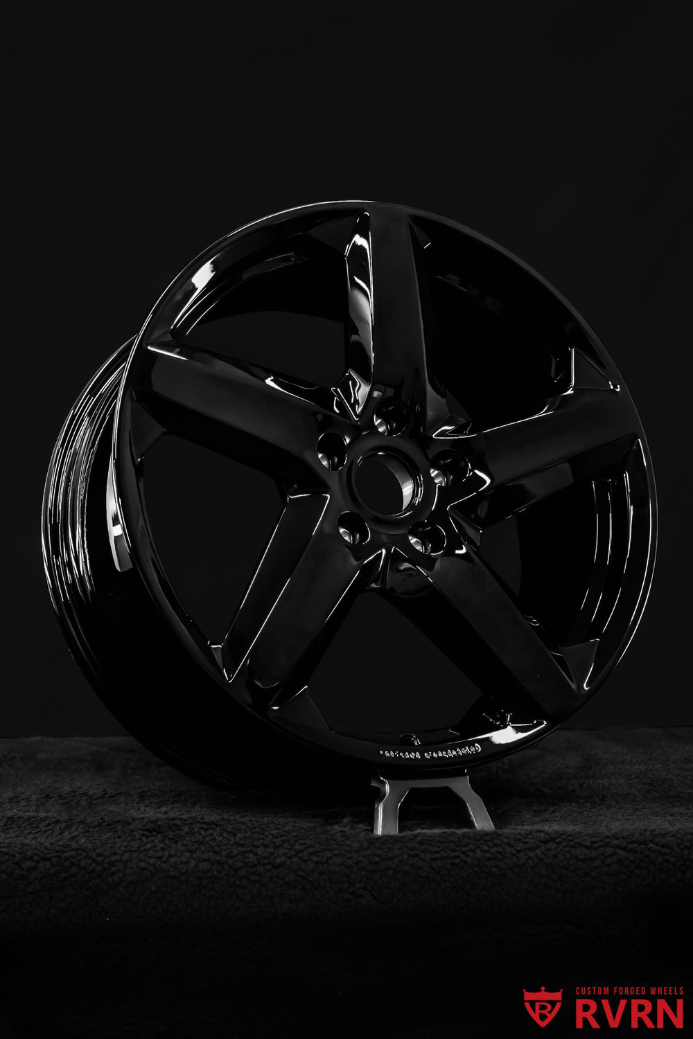 Close-up of RVRN RV-MT02 Corvette C7 forged wheels showing the directional 5-spoke design and gloss black spokes
