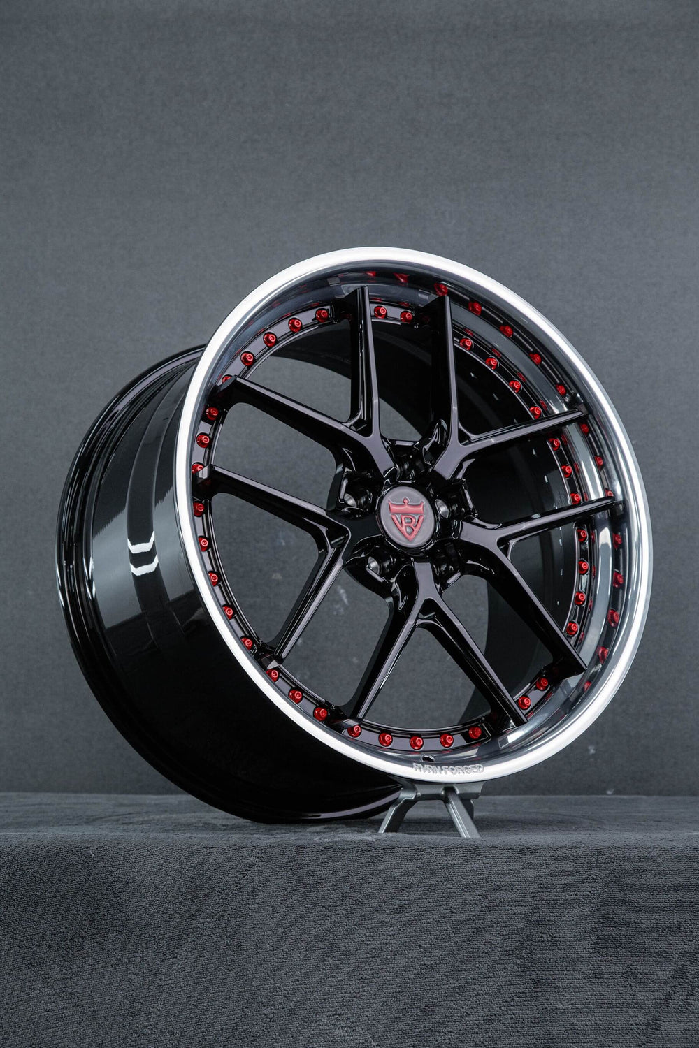 Angled view of the Gloss black RVRN RV-DR08D forged wheel showing the polished lip and red screws, 2015 Corvette C7 Z51