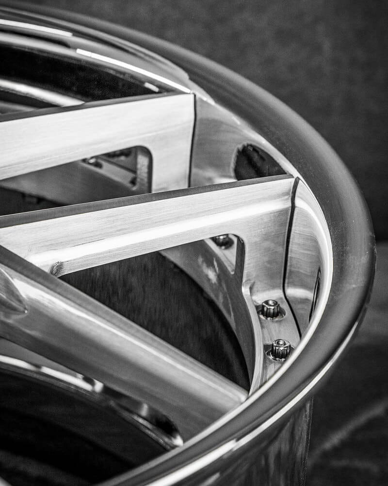 Staggered chrome deep dish wheels enhancing the C7 Z51 stance.
