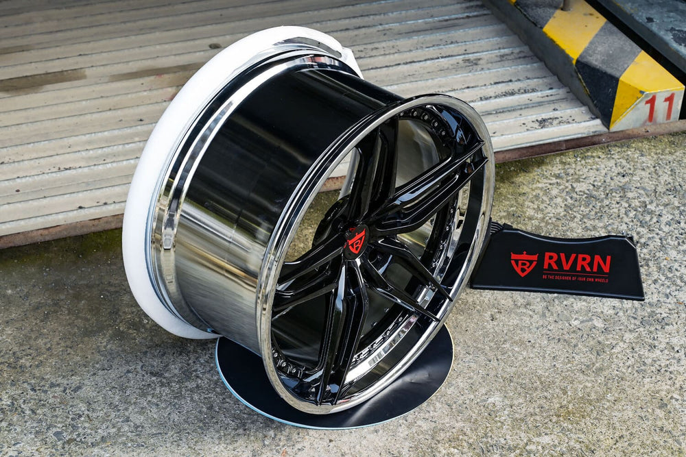Gloss black five-spoke RVRN RV-DP03 forged wheel with a polished chrome barrel beside the RVRN sign, custom wheels for the 2016 Corvette C7 Stingray