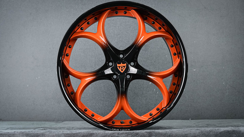Front angle of Jaguar F Type with RV-DS016 custom wheels in orange fade to black