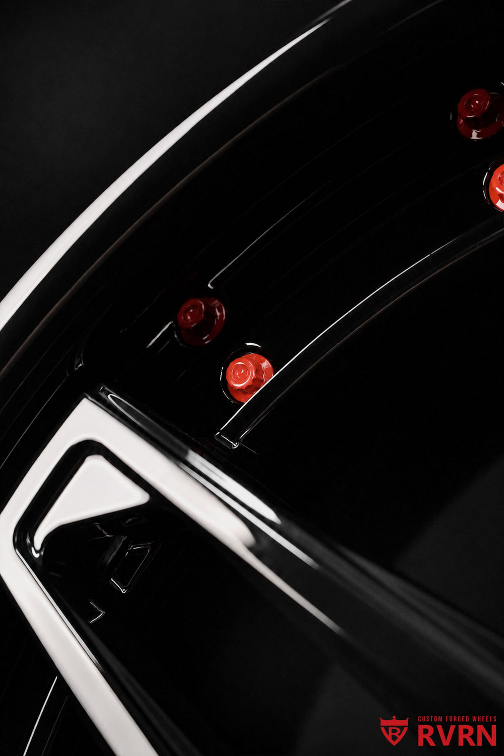 Close-up detail of RVRN RV-DS74 2-piece forged wheel construction with gloss black finish and precision machining