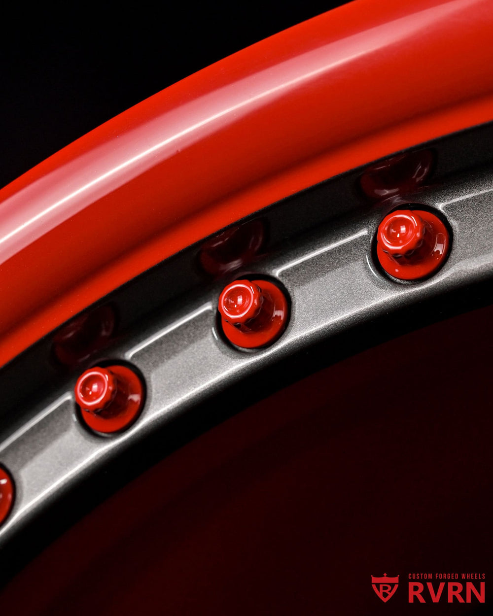 Custom finish Corvette C7 wheel design combining shark gray and red tones for a bold high-performance appearance