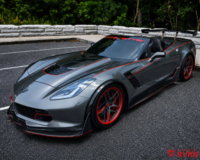 2016 Corvette C7 Z06 on RVRN RV-MC36 monoblock 5-spoke custom forged wheels in Red and Shark Gray with red barrel, front three-quarter view with the top down.