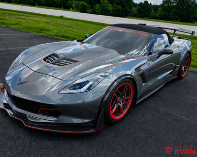2016 Corvette C7 Z06 on RVRN RV-MC36 5-spoke custom forged wheels with red barrel, front three-quarter view showing the Shark Gray body with red accents.