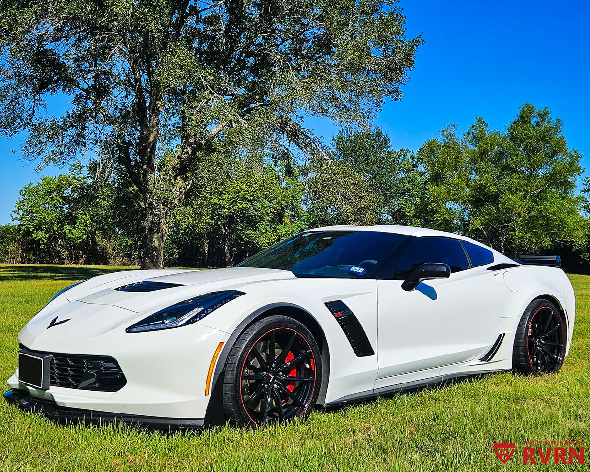 2016 Corvette C7 Z06 on RVRN RV-MJ02 monoblock custom forged wheels in All Gloss Black with Red Rim pinstripe, front three-quarter view on a grassy field.