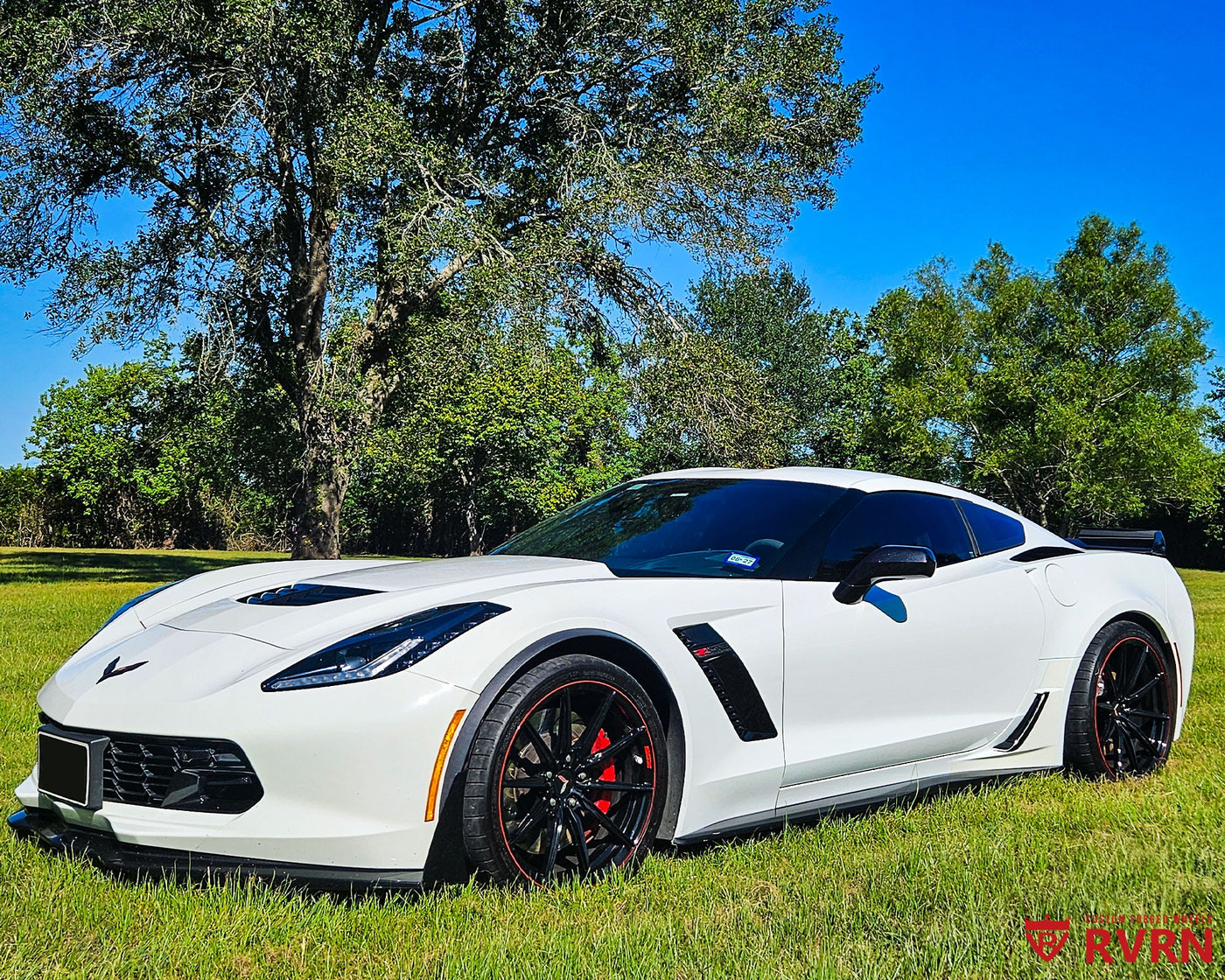 2016 Corvette C7 Z06 on RVRN RV-MJ02 monoblock custom forged wheels in All Gloss Black with Red Rim pinstripe, front three-quarter view on a grassy field.