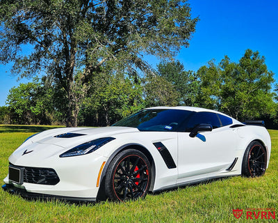 2016 Corvette C7 Z06 on RVRN RV-MJ02 monoblock custom forged wheels in All Gloss Black with Red Rim pinstripe, front three-quarter view on a grassy field.