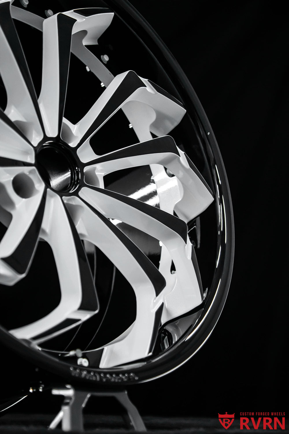 Close-up of RVRN RV-DC01 deep dish forged wheels for 2017 Corvette C7 Z06, featuring directional spokes, Pearl White accents and Gloss Black finish