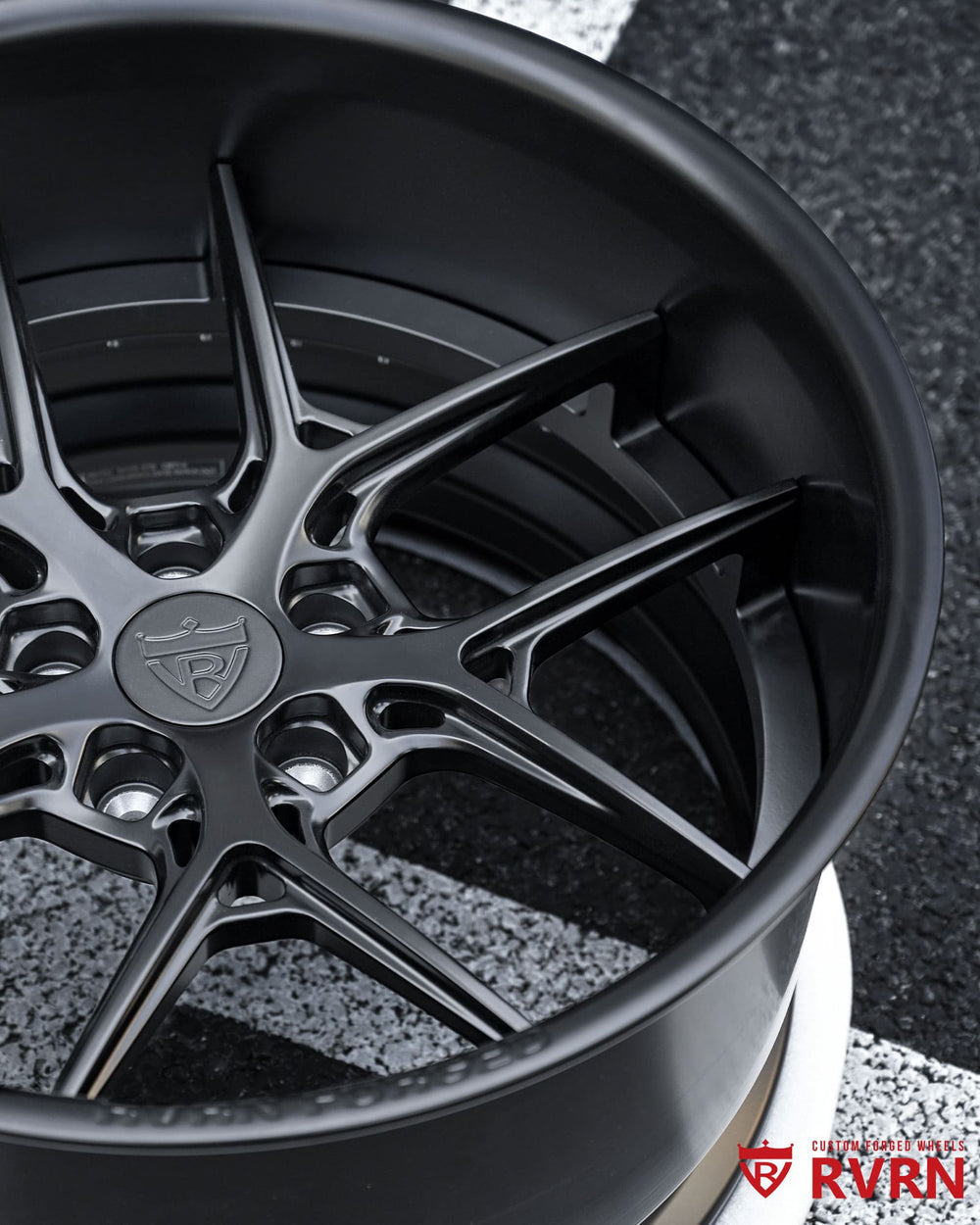 Deep dish Dodge rims with matte black finish, showcasing custom forged construction and Y-spoke styling