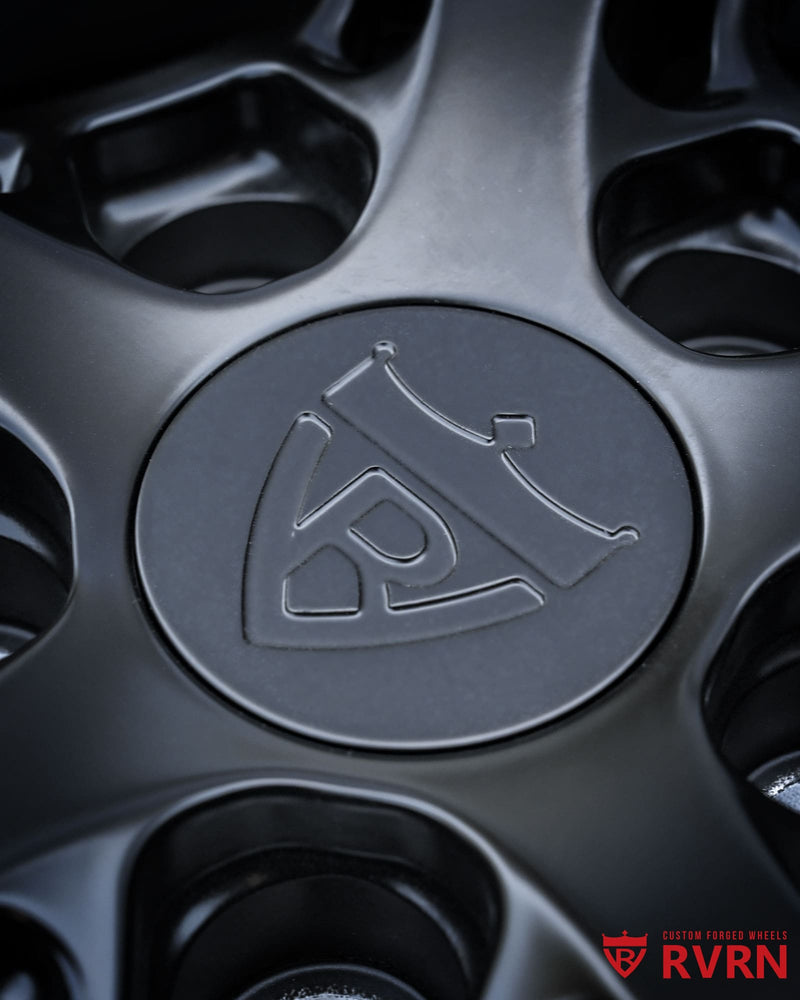 Matte black Y-spoke wheel center section featuring custom forged construction and premium machining quality