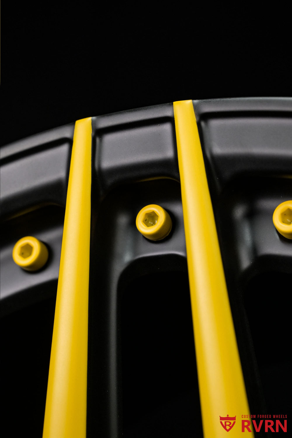 Close-up of custom yellow accents across the matte black spokes on RVRN RV-MP03 forged wheels for the Dodge Challenger, 20x11 rear fitment