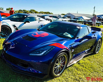 2017 Corvette C7 Grand Sport on RVRN RV-DC04 2-piece custom forged chrome wheels, front three-quarter view on the show field.