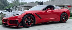 Side view of a red 2017 Corvette C7 Z51 with rear wing on RVRN RV-DS016 deep dish wheels, red and black spokes