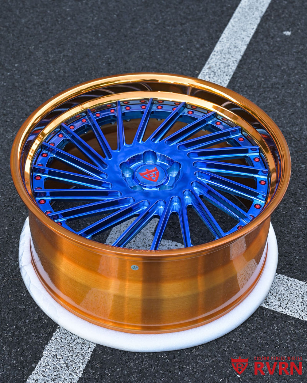 Close-up of polished blue spokes on RV-DN01 Vanderhall Wheels for 2018 Venice, highlighting custom forged wheel design.