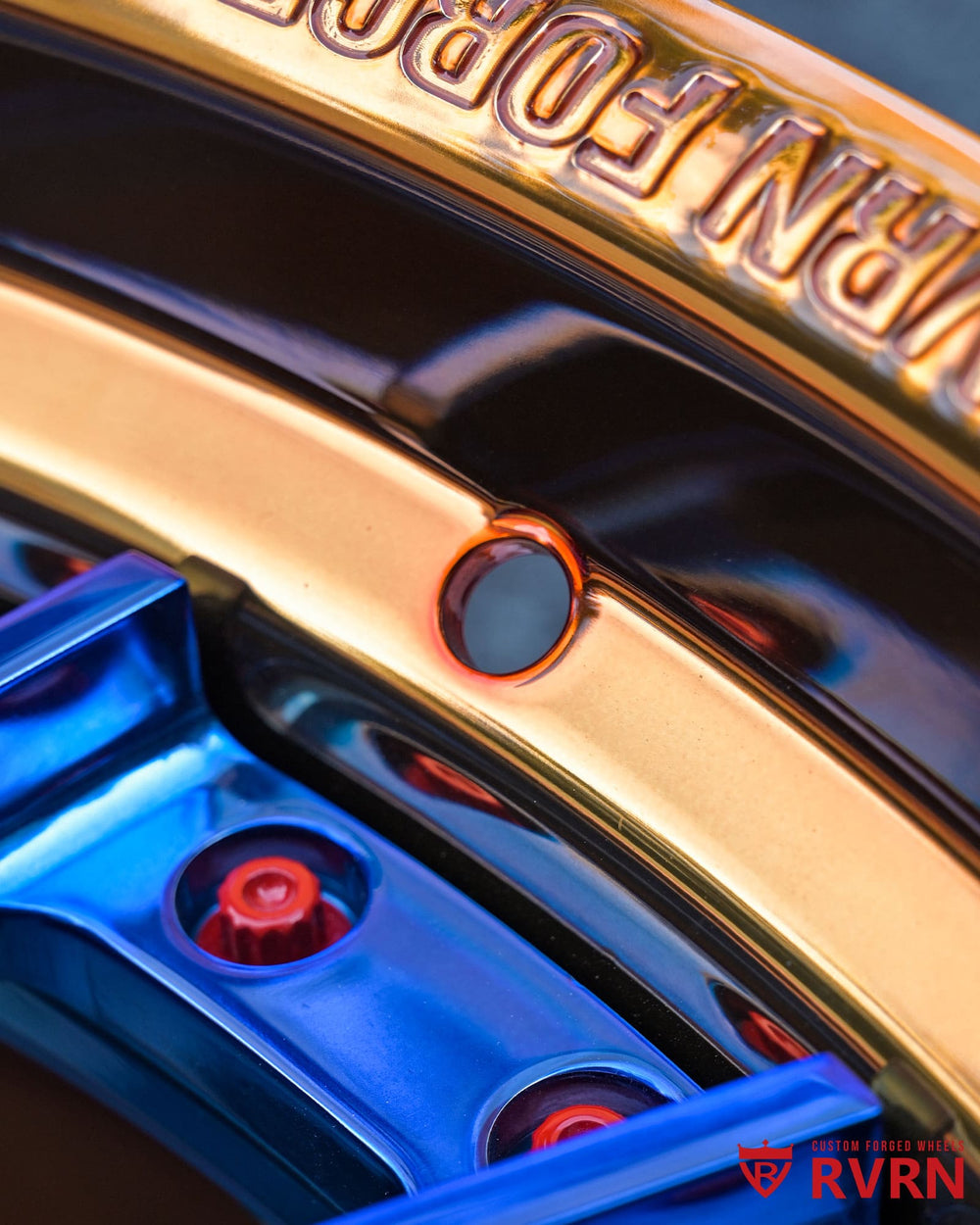 3/4 view of RV-DN01 Vanderhall Wheels, custom 22x9 front, 22x10.5 rear, polished bronze with polished blue.