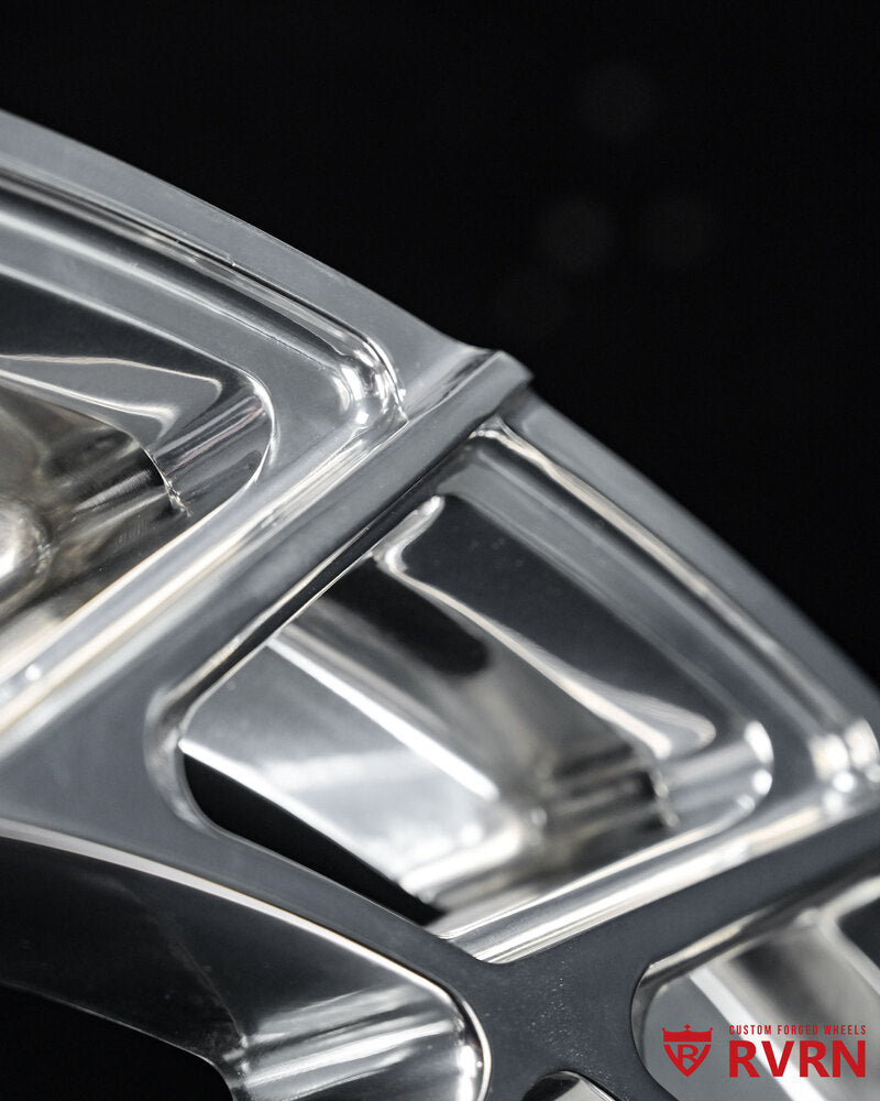 Close-up of 2018 Audi SQ5 custom 21x10 forged wheels in polished aluminum.