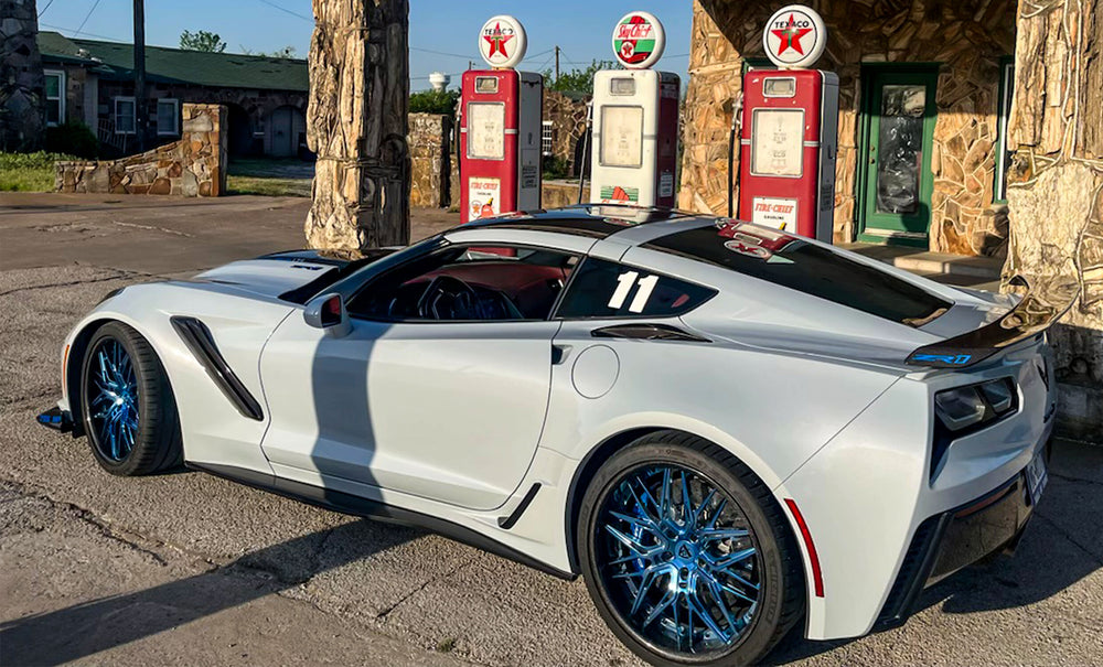 Close-up of polished blue spoke finish on Corvette ZR1 rims