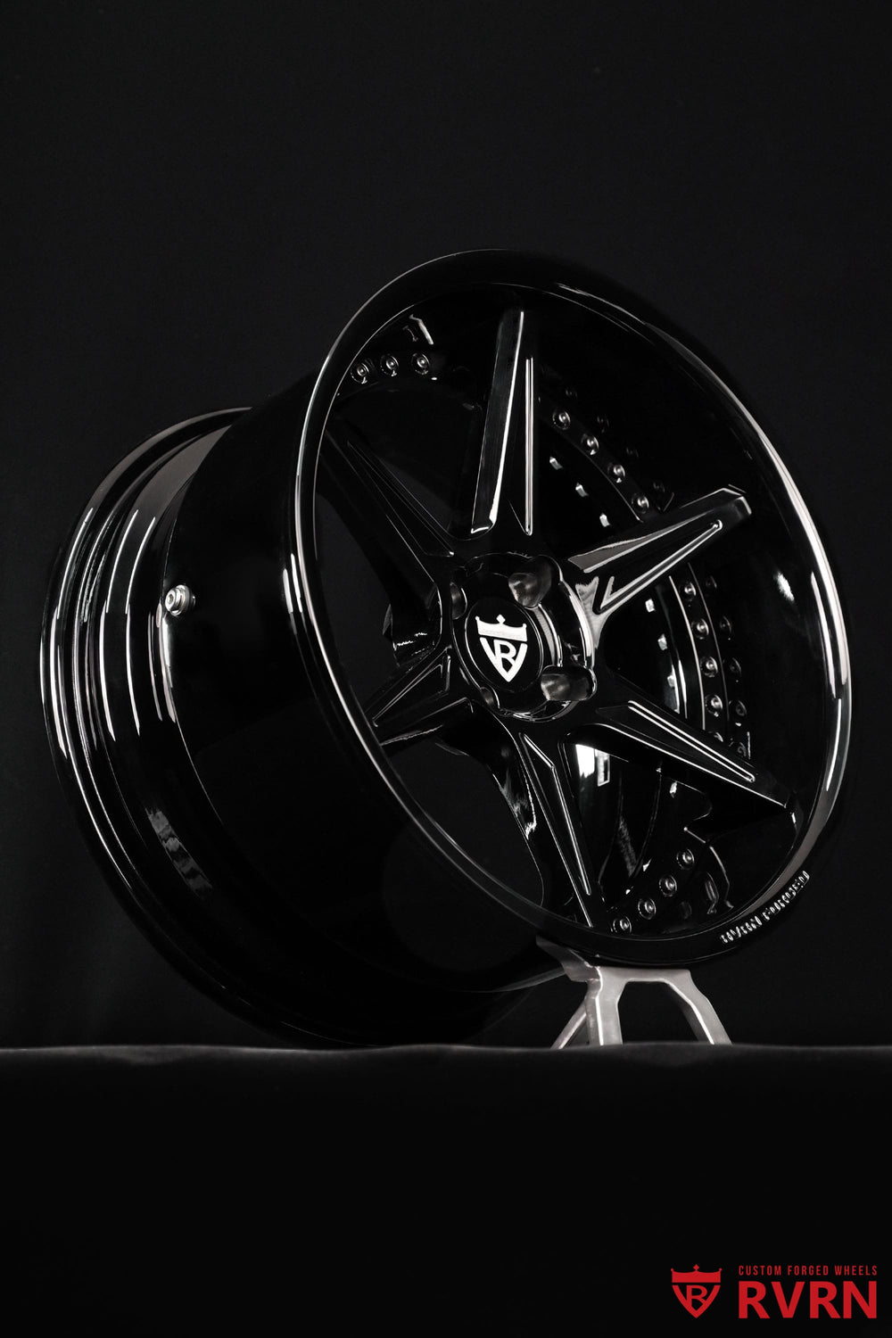 Close-up detail of RVRN RV-DC19 custom Mazda MX-5 wheels, showing the sculpted 6-spoke design, concave profile and gloss black finish