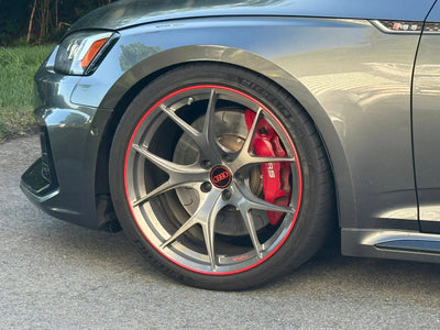 Audi RS5 showcasing custom lightweight RVRN wheels with red accents for enhanced performance and style.