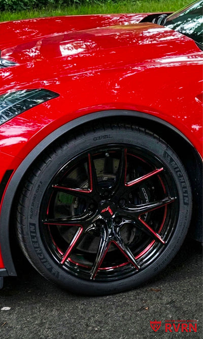Close-up of RVRN RV-MC61 Y-spoke custom forged wheels on a 2019 Corvette C7 Grand Sport, finished in gloss black with red accents and Corvette center caps.