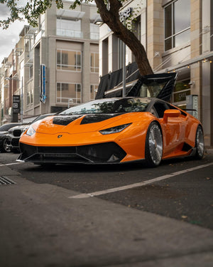 2019 Lamborghini Huracan LP-580 on RVRN RV-MD02 full face custom forged wheels in Brushed Aluminum finish, front three-quarter view at High Street event, Gilbert Arizona.