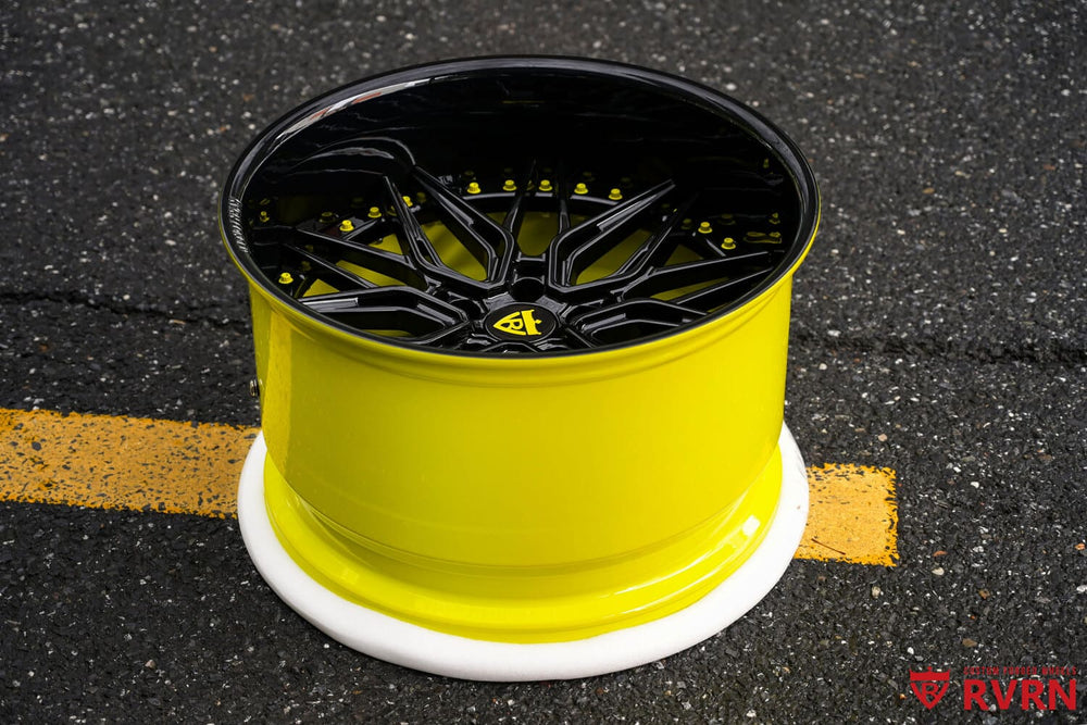 Close-up of yellow and gloss black forged Corvette wheel
