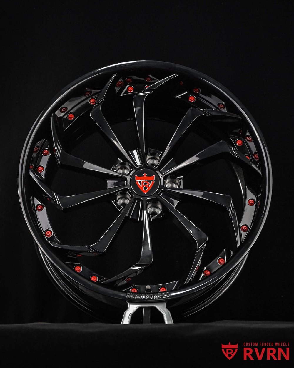 All black Corvette C8 Stingray wheels with directional spoke pattern and red hardware accents by RVRN Wheels