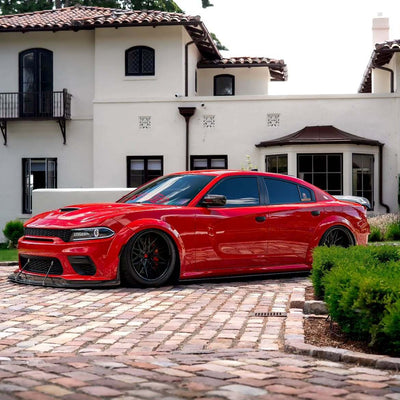 2020 Dodge Charger 392 Scatpack Widebody on RVRN RV-T081 custom forged wheels, front three-quarter view in front of a Mediterranean style home.