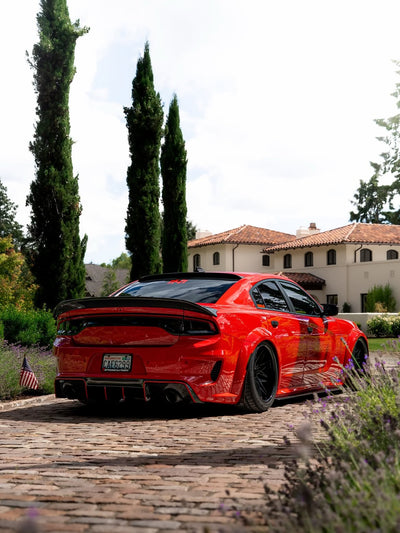2020 Dodge Charger 392 Scatpack Widebody on RVRN RV-T081 deep dish forged wheels, rear three-quarter view showing the 20x12 wide rear fitment in front of the mansion.