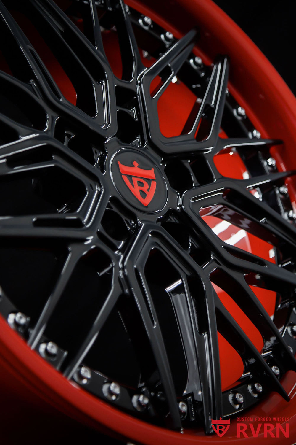 Rear wheel detail showing RVRN RV-C081 Corvette C8 forged wheels in 20x11 +45 with Gloss Black spokes and Gloss Red barrel.