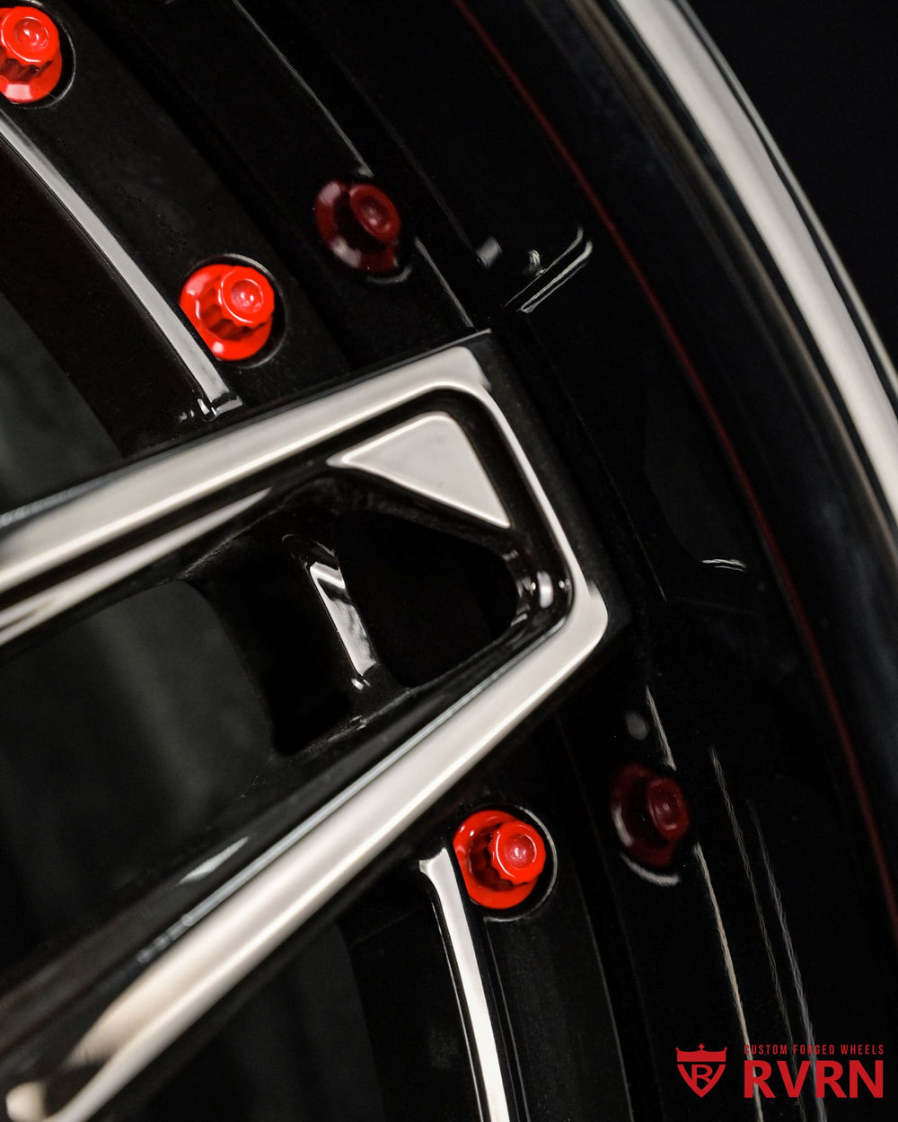 Gloss black and red Corvette C8 forged wheels detail showing premium spoke finish and forged 2-piece construction