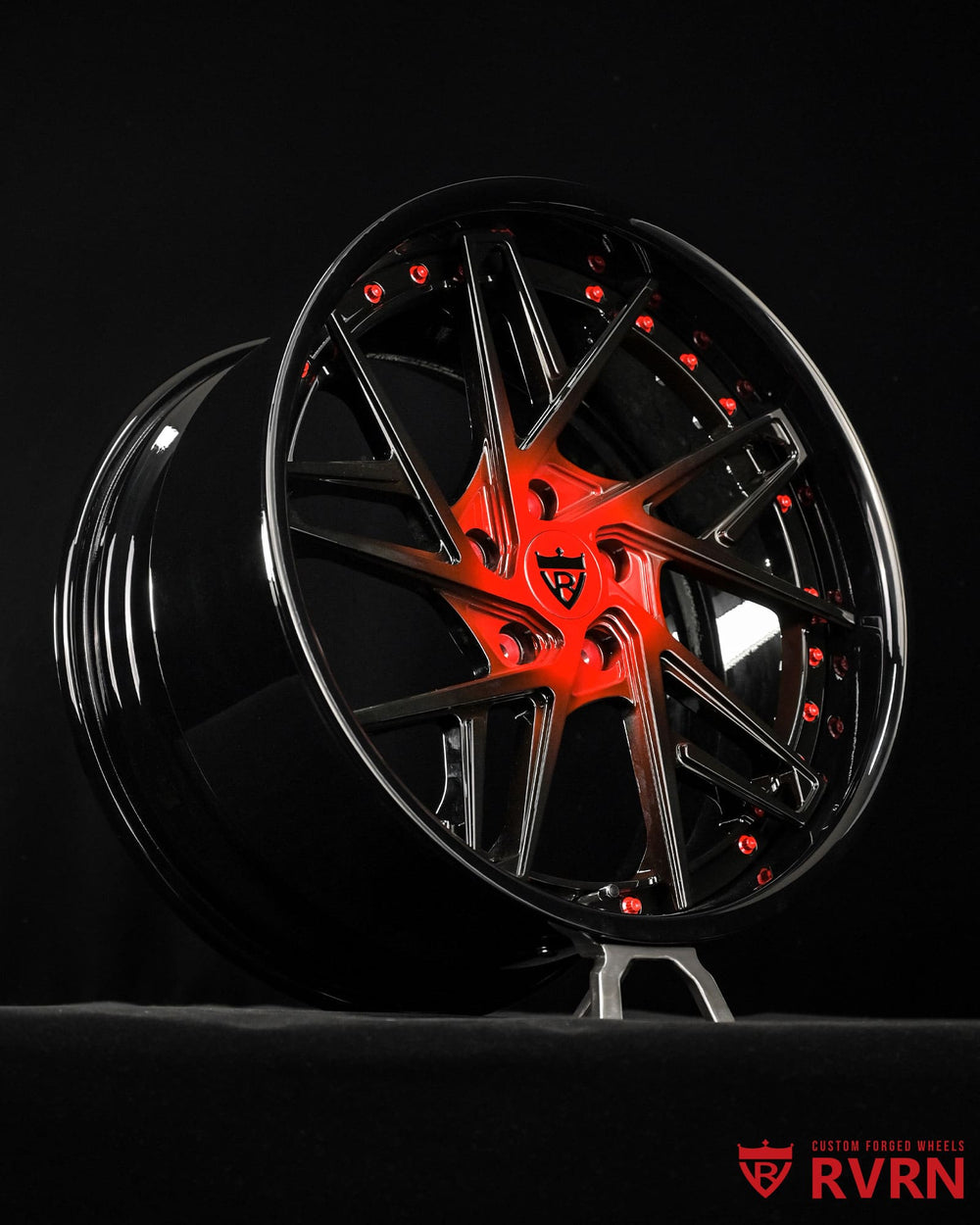 Wheel face detail of Corvette C8 custom forged wheels RV-DS74 with bold red spoke accents and gloss black finish