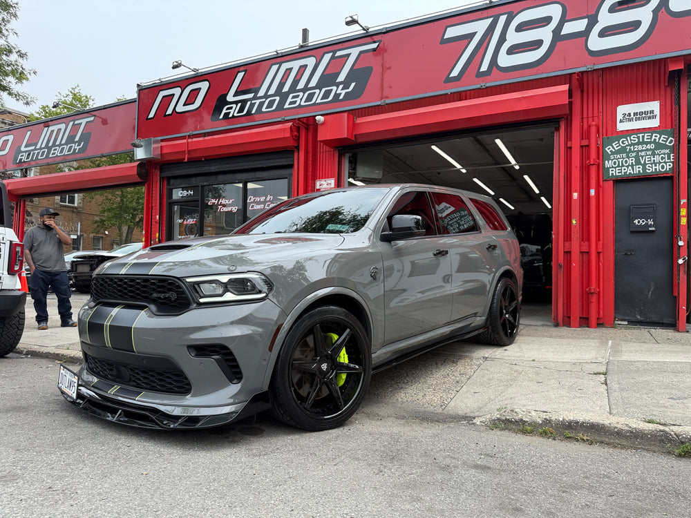 Grey 2021 Dodge Durango SRT Hellcat on Gloss Black RVRN RV-DC19 forged wheels outside an auto body shop