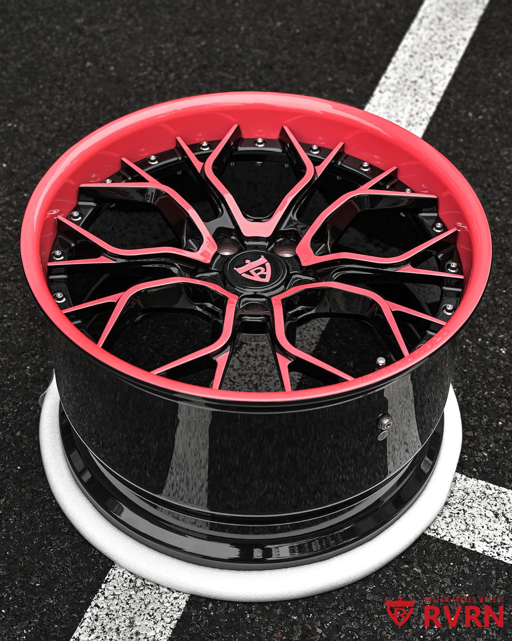 Custom pink and black Jeep Wrangler wheels 20x12.5 forged two piece setup by RVRN Wheels with gloss black barrel and pink spoke accents