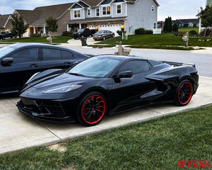 2021 Corvette C8 Stingray on RVRN RV-DC01 gloss black red directional forged wheels, front three-quarter view.