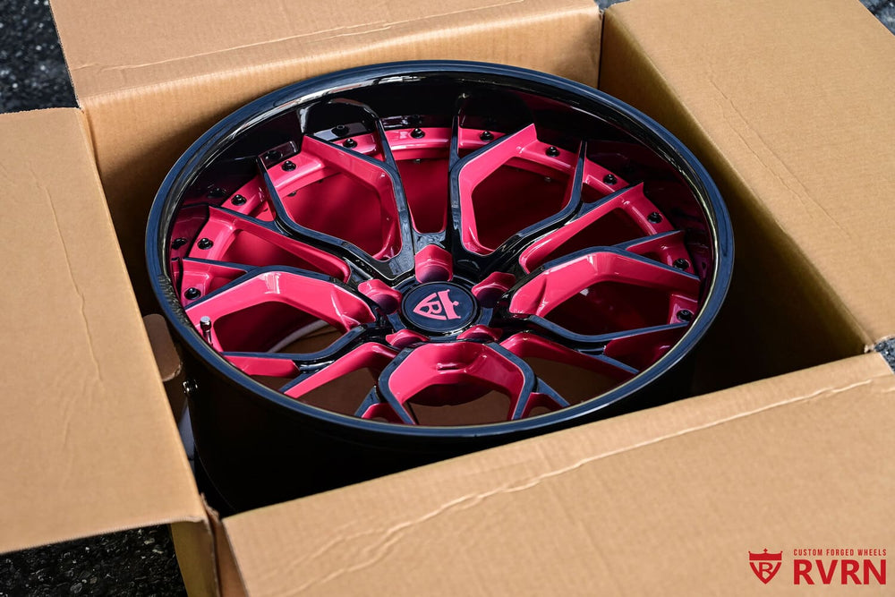 Detailed view of pink spoke and black screws on custom rims