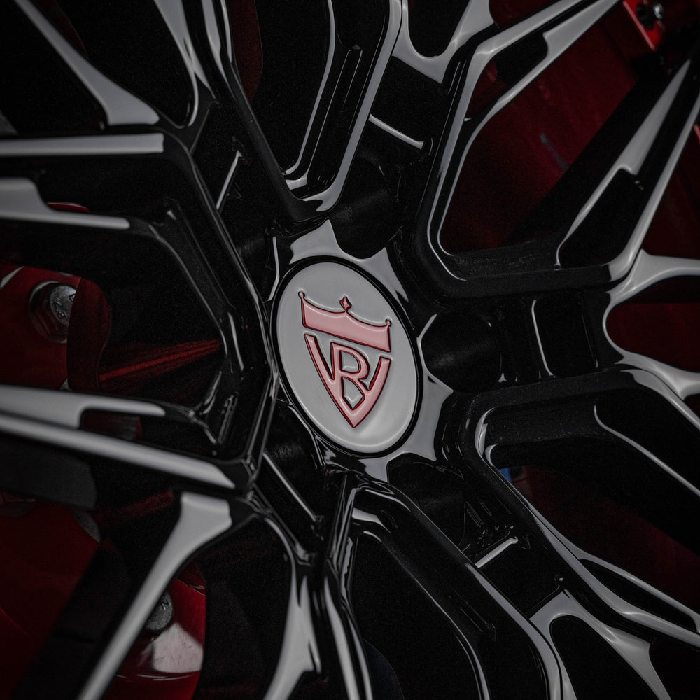 Close-up of custom black forged RVRN wheels on a 2021 red and black Ford Shelby GT500.