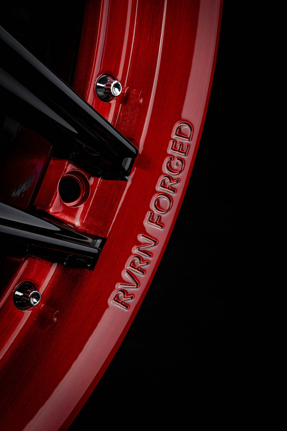 Close-up of red custom forged wheels on 2021 Ford Shelby GT500 featuring RVRN wheels logo with black trim.