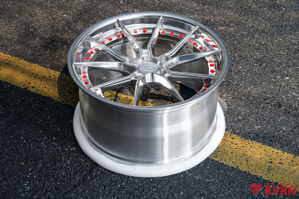 Polished aluminum five-spoke RVRN RV-DB082 forged wheel on the pavement beside the RVRN sign, 2022 Corvette C8 Z51