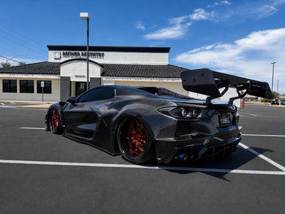 2022 Corvette C8 Stingray Z51 on RVRN RV-DR16 forged deep dish wheels, front detail view showing the widebody stance and Rose Gold spoke design.