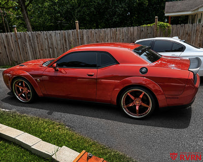 2022 Dodge Challenger Scat Pack Widebody on RVRN RV-DF14 custom forged wheels with rose gold finish, side profile in front of the wooden fence showing the riveted chrome barrel.