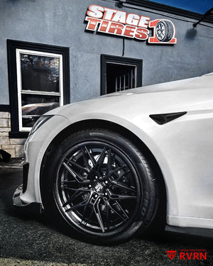 Wheel close-up of a 2022 Tesla Model S on RVRN RV-C081 carbon fiber lip wheels with matte black spoke and barrel finish.