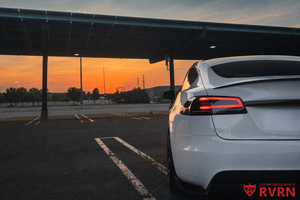 Rear sunset view of a 2022 Tesla Model S with RVRN RV-C081 matte black custom forged wheels and carbon fiber wrapping lip.