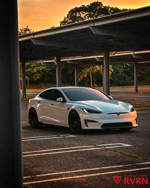 Front three-quarter sunset view of a 2022 Tesla Model S fitted with RVRN RV-C081 matte black carbon fiber lip custom forged wheels.