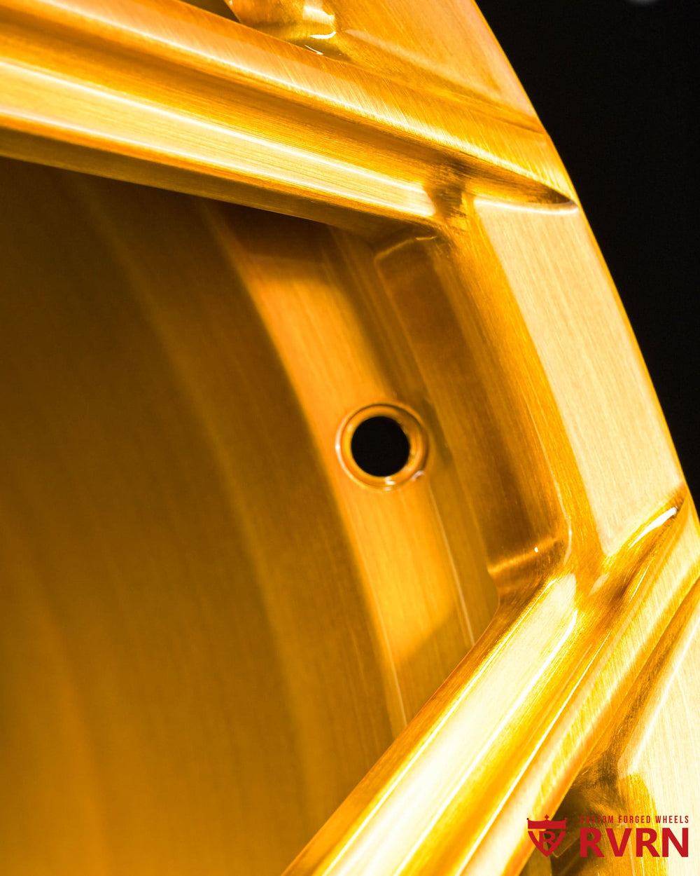 Close-up of RV-MC491 forged wheel hardware and screws, brushed gold finish, 22x10.5/22x11.5 for Aston Martin