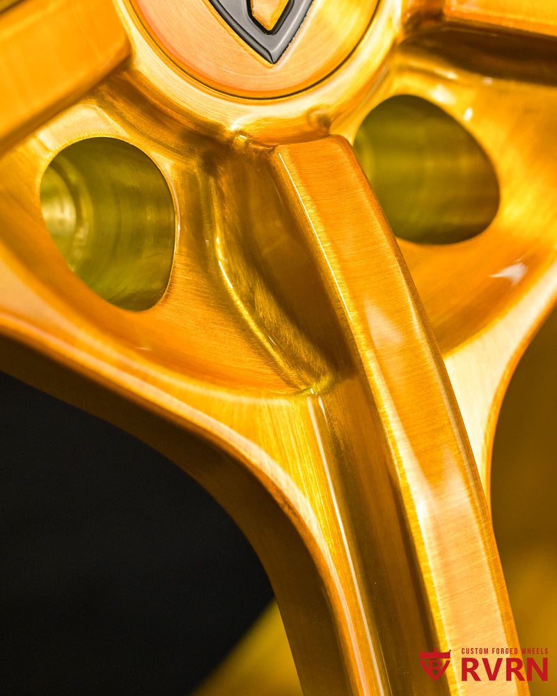 RV-MC491 installed on rear of 2023 DBX 707, 22x11.5 forged brushed gold wheels, custom Y-spoke design
